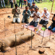 Archaeologists hold a religious ceremony to ask the spirit protecting the site for permission to move the statue. (Image: Apsara Authority via The Cambodia Daily)